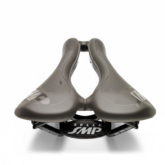 Gray bicycle saddle with Selle SMP logo on a white background