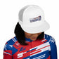 Person wearing a white cap with &